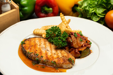 Grilled salmon with lemon and potato on wooden