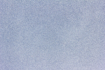 Full frame macro abstract texture background of a frosted glass window pane with natural ice crystals