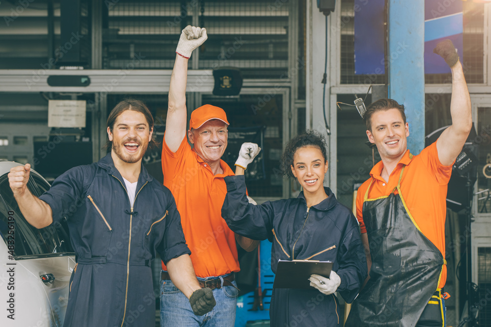 Wall mural group of mechanic staff car service team worker people in garage happy smile hand risign