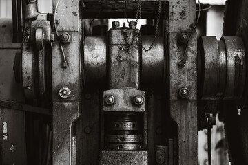 heavy industry old grunge steel machinery mechanical engineering machine closeup black and white for background