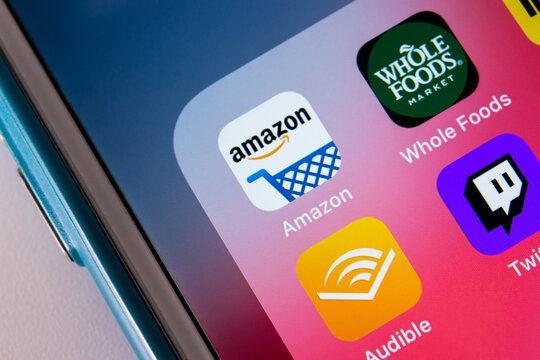Kumamoto / JAPAN - Oct 3 2020 : Amazon and its subsidiaries (Whole Foods, IMDb, Audible, Twitch and Alexa) on iPhone screen.