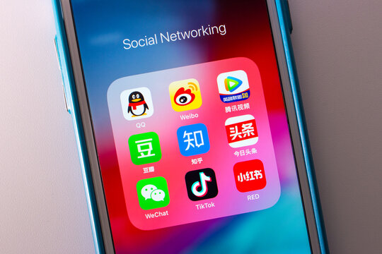 Kumamoto, JAPAN - Oct 3 2020 : The Chinese Popular Social Media Services Icons (Tencent QQ, Sina Weibo, Tencent Video, Douban, Zhihu, Jinri Toutiao WeChat, TikTok, Xiao Hong Shu) on iPhone Screen.