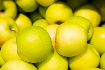 background of green apples on sale at the local market