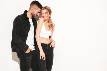 Sexy smiling beautiful woman and her handsome boyfriend. Happy cheerful family having tender moments.Young passionate couple hugging. Sensual pair isolated