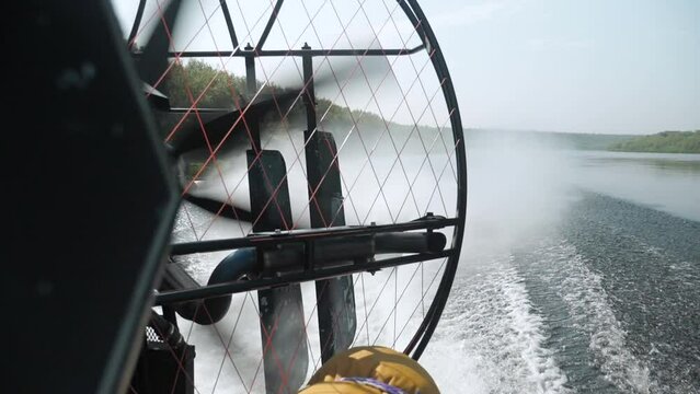 A hovercraft is floating on the river. the footage was shot from different angles at different times of the day and weather.
