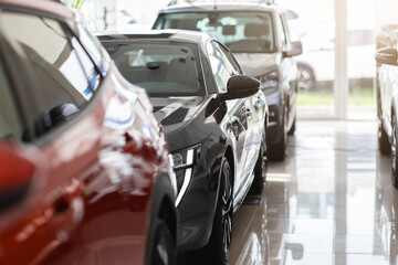 Closeup of brand new luxury automobiles in vip showroom