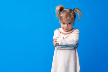 Naughty little girl over the blue background