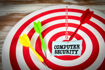COMPUTER SECURITY. Red target and darts in the center