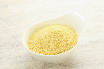 Raw couscous in the bowl