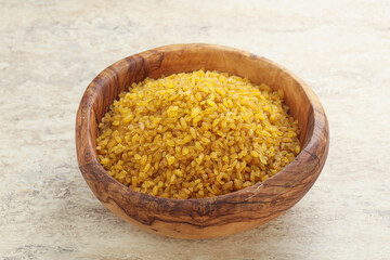 Raw bulgur in the bowl