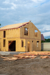 Construction of new and modern modular house. Walls made from composite wooden sip panels with...