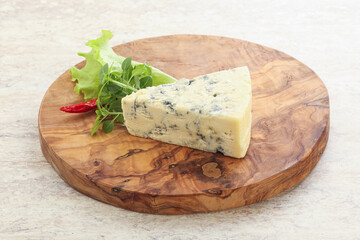 Blue cheese piece over board