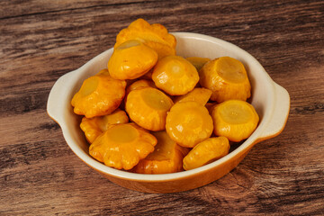 Marinated yellow patisson in the bowl