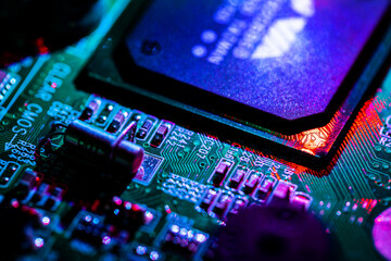 Fototapeta na wymiar Close up of components and microchips on PC circuit board..