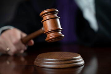 Courtroom. Judge with the wooden gavel in his hand. Law and justice theme.