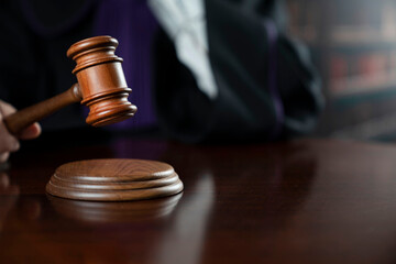 Courtroom. Judge with the wooden gavel in his hand. Law and justice theme.