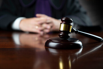 Courtroom. Judge with the wooden gavel in his hand. Law and justice theme.