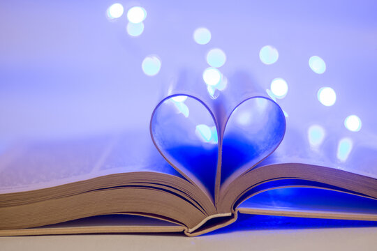 Book pages in the shape of a heart.