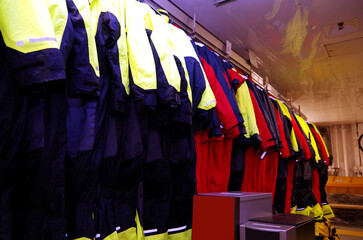 Changing and equipment room with high tech polar jackets, waterproof shoes and expedition equipment...