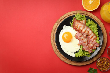 Concept of tasty breakfast on red background