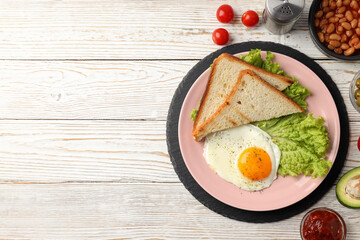 Concept of tasty breakfast on white wooden background