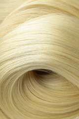 Blonde female hair on whole background, close up
