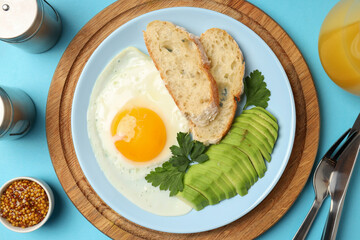 Concept of tasty breakfast on blue background