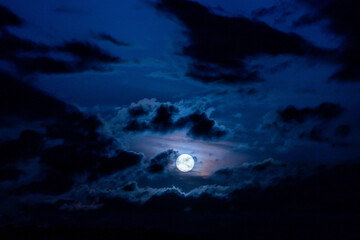The Moon Between Night Clouds