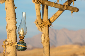 A traditional kerosene lamp hanging on the entrance of bedouin house. Arabic ancient home in South Sinai, Egypt.