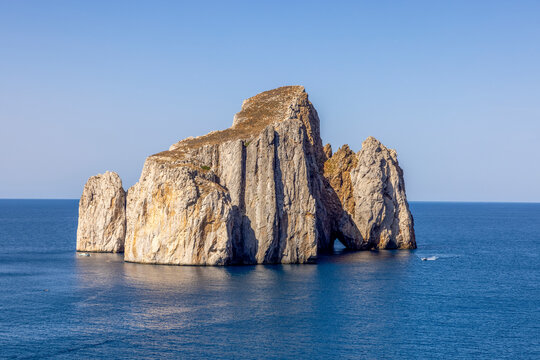 Scoglio Pan di Zucchero in calm Mediterranean on a clear day