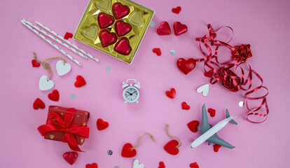 Valentine's Day holiday concept. On a pink background, valentine's day. Airplane travel.