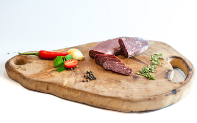 Fresh meat and vegetables on wooden boards