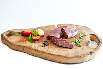 Fresh meat and vegetables on wooden boards