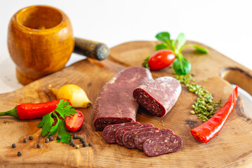 Fresh meat and vegetables on wooden boards