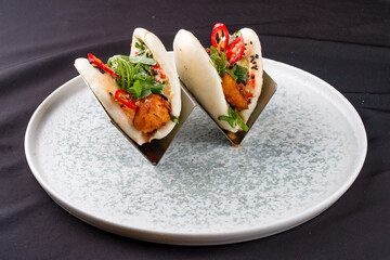 Bao, steamed rice buns, with chicken.
