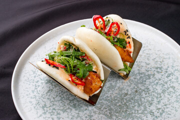 Bao, steamed rice buns, with chicken.