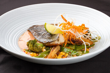 Sea bass fillet, with smoked paprika and WOK vegetables.