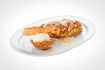 Apple strudel with an ice cream scoop. On a white background.