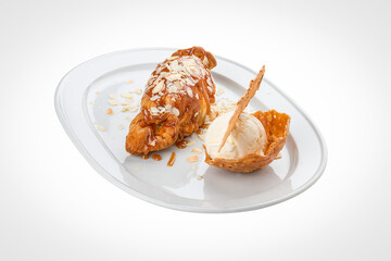Apple strudel with an ice cream scoop. On a white background.