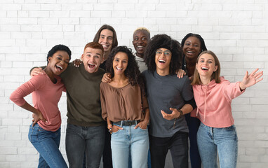 Cheerful multiracial men and woman students showing their white smiles