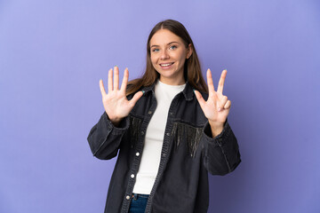 Young Lithuanian woman isolated on purple background counting eight with fingers