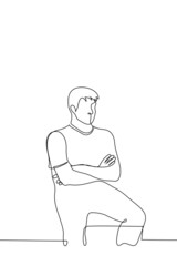 man with inflated shoulder muscles and crossed arms sits with his legs spread - one line drawing vector. concept of strong man sitting in dominant position