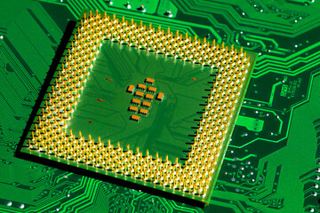 Close up of microchips and pins on Main CPU PC processor circuit board..