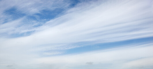 Naklejka na ściany i meble Panoramic photo of blurred sky. Blue sky background