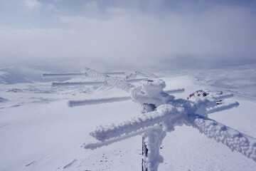Frozen antenna on the ridge of Avachinsky volcano in winter