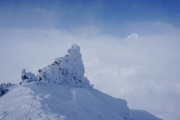 Frozen rocks on the ridge of Avachinsky volcano in winter