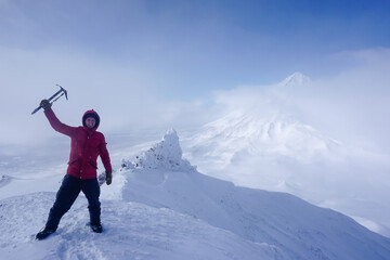 Hiker with an ice ax at the Avachinsky Pass