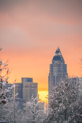 Frankfurt am Main in the snow, a rare sight for Frankfurt. Morning above street shot with lights and the sunrise behind the skyline.