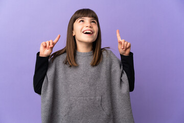 Little girl over isolated background surprised and pointing up