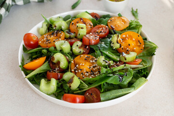 a fresh vegetable salad. tomatoes, celery and lettuce leaves 